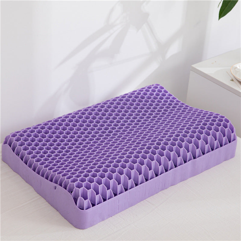 A cost-effective Neck Message Bed Pillow 3D by Cloud Dreams, featuring a purple honeycomb-pattern gel cushion, lies on a white surface against a light-colored background, making it an ideal zero-pressure sleeping pillow.
