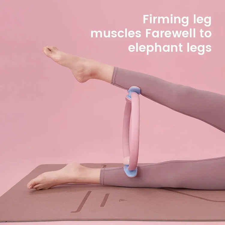 Set against a pink backdrop, a person is working out on a yoga mat with the INGPENG Yoga Fitness Pilates Ring around their legs. The text reads, "Firming leg muscles. Farewell to elephant legs.