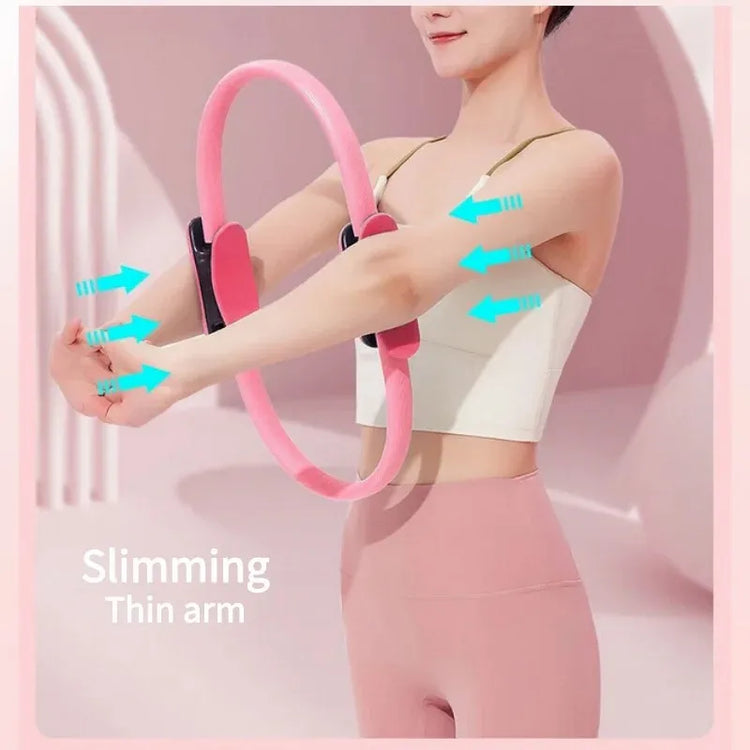 A person uses the INGPENG Yoga Fitness Pilates Ring for arm workouts while wearing a white tank top and pink leggings. Arrows highlight targeted arm slimming, incorporating strength training techniques for optimal results.